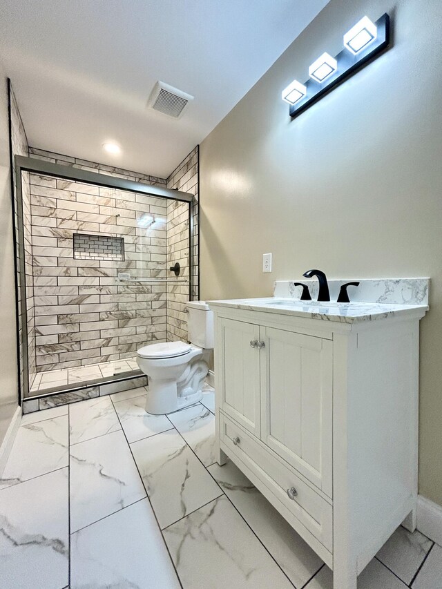 bathroom with vanity, toilet, and walk in shower