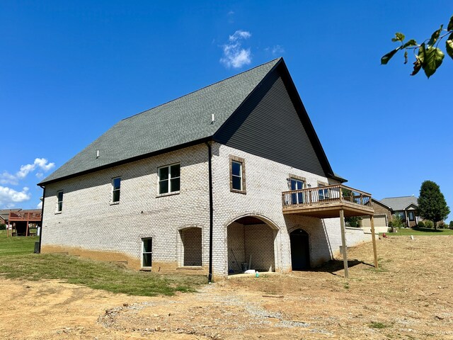 view of property exterior featuring a wooden deck