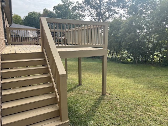 wooden terrace with a yard