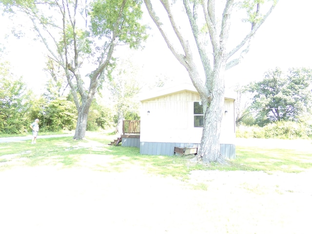 view of side of home with a wooden deck