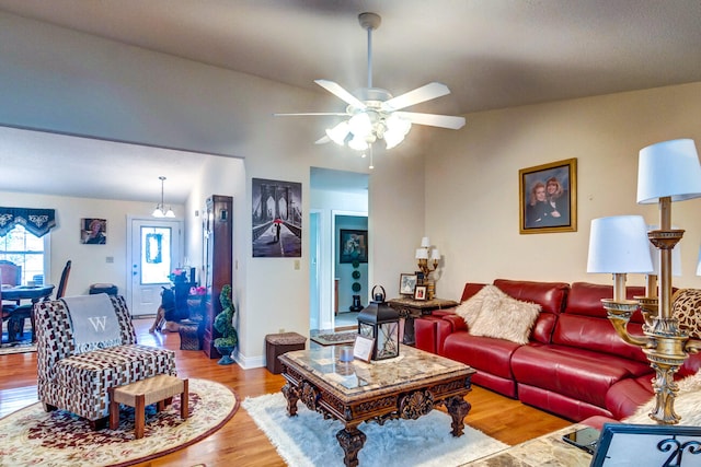 living room with ceiling fan and light hardwood / wood-style floors