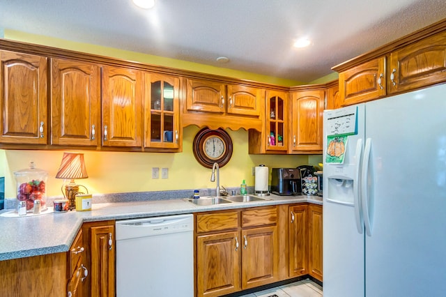 kitchen with white appliances and sink