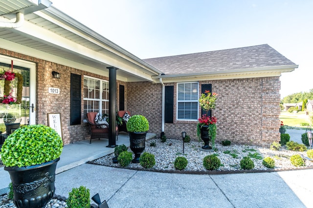 property entrance featuring covered porch