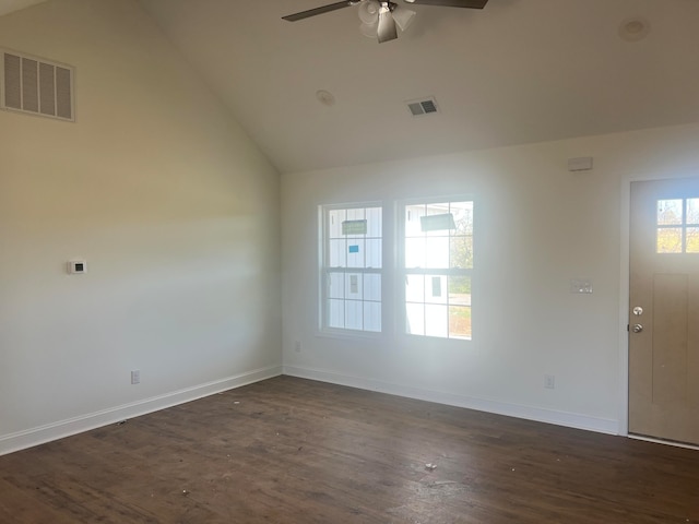 empty room featuring ceiling fan, high vaulted ceiling, and dark hardwood / wood-style flooring