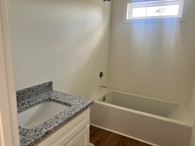 bathroom featuring hardwood / wood-style flooring and vanity