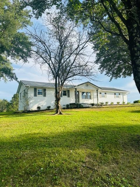 view of front of property with a front lawn