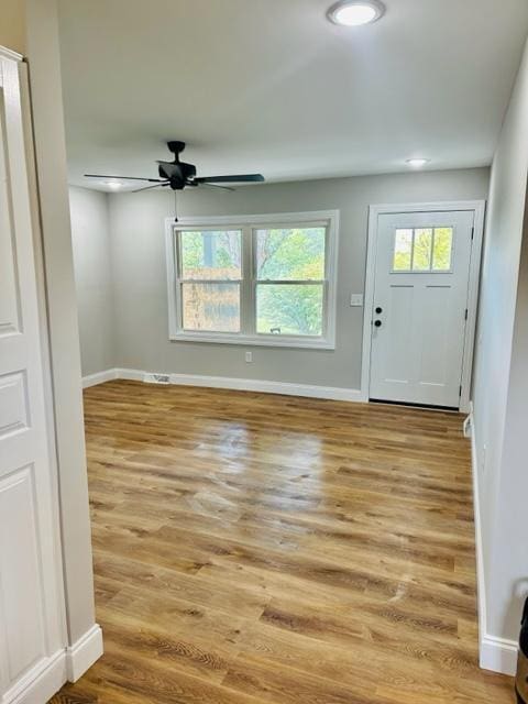 entryway featuring light wood-type flooring and ceiling fan