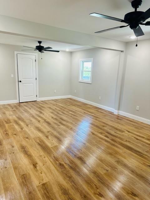 unfurnished room featuring ceiling fan and light wood-type flooring