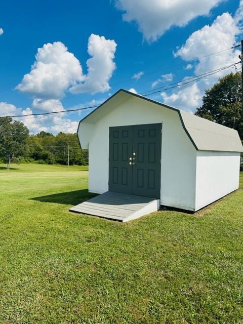 view of outdoor structure with a yard