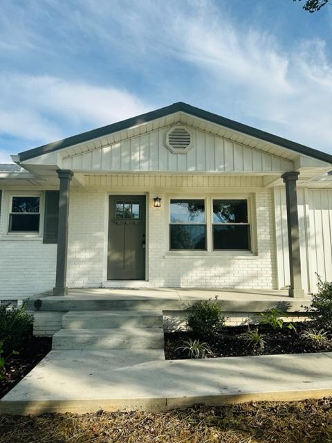 entrance to property with a porch