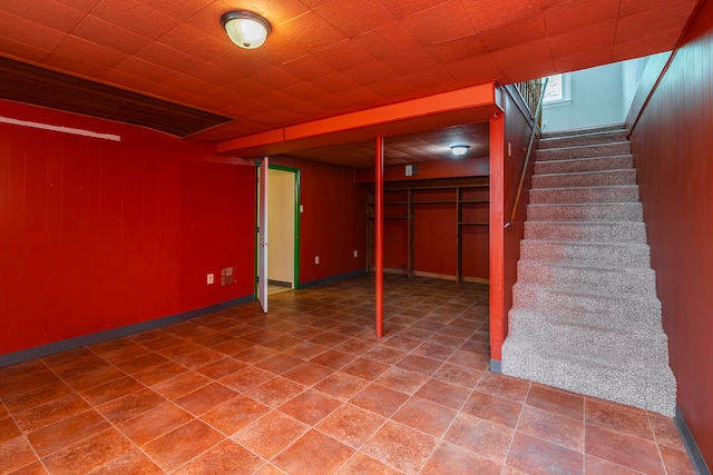 basement with wood walls