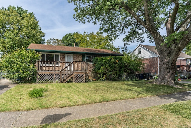 ranch-style home with a front lawn and a deck