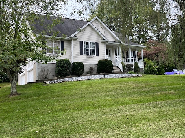 view of front of home featuring a garage, a front lawn, and a porch