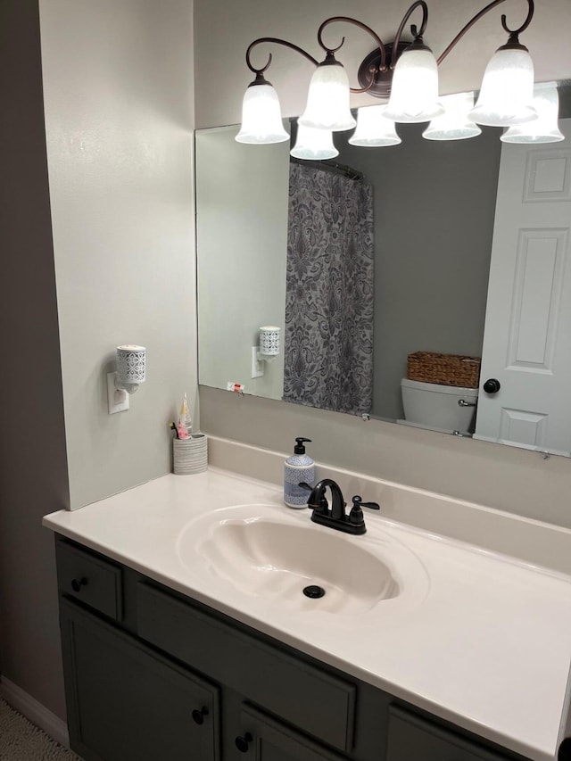 bathroom with vanity and toilet