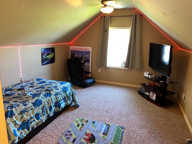 carpeted bedroom with ceiling fan and lofted ceiling