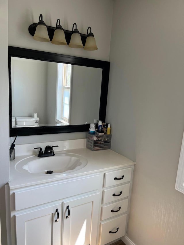 bathroom with vanity and toilet