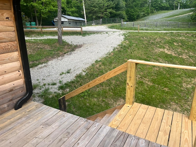 dock area with a lawn and a wooden deck