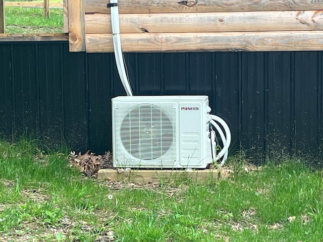 exterior space featuring ac unit and wooden walls