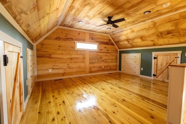 additional living space featuring light wood-type flooring, vaulted ceiling, and wood ceiling