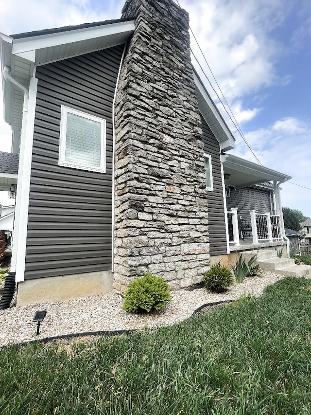 view of home's exterior with covered porch