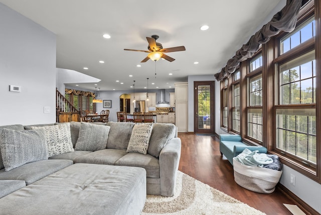 living room with hardwood / wood-style floors and ceiling fan