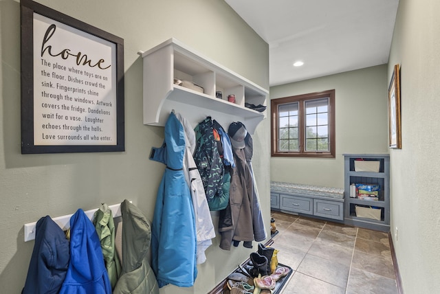 mudroom with light tile patterned floors