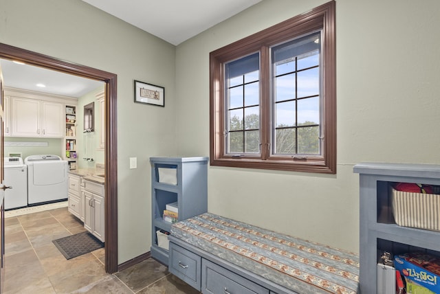 mudroom with independent washer and dryer