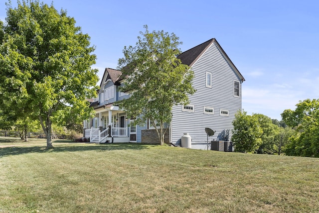 view of side of home with a lawn