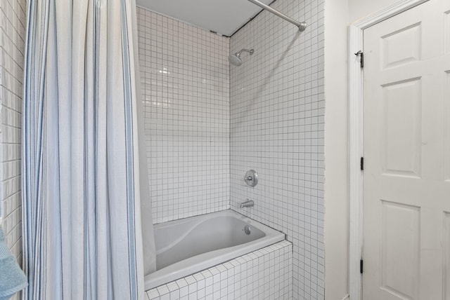 bathroom with shower / tub combo with curtain