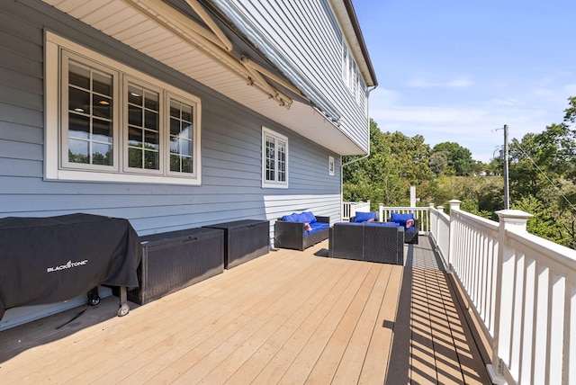 wooden deck featuring an outdoor hangout area