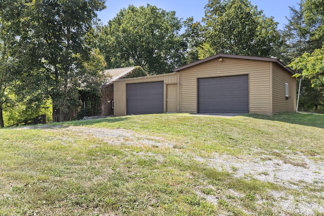 garage with a yard