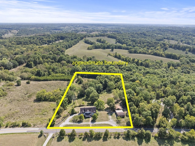 birds eye view of property featuring a rural view