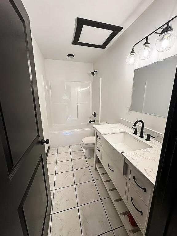 full bathroom featuring toilet, vanity, shower / bath combination, and tile patterned floors