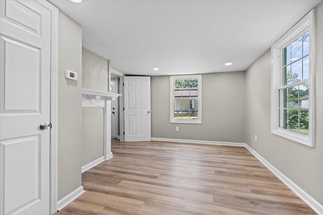 spare room featuring light wood-type flooring