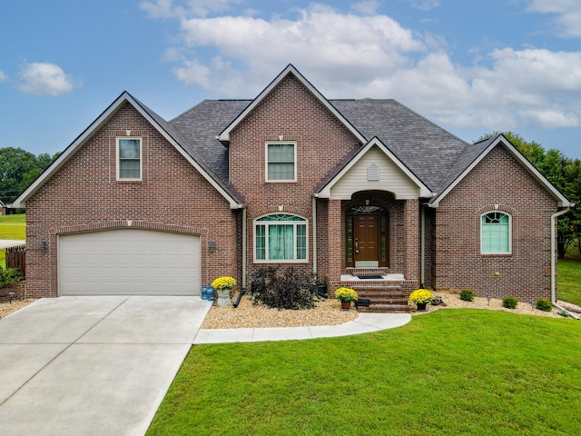 view of front of house with a front lawn and a garage