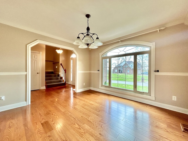 244 Water Cliff Dr, Somerset, KY 42503 - kitchen featuring white cabinets, arched walkways, light wood finished floors, and glass insert cabinets