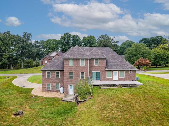 view of side of property with a yard