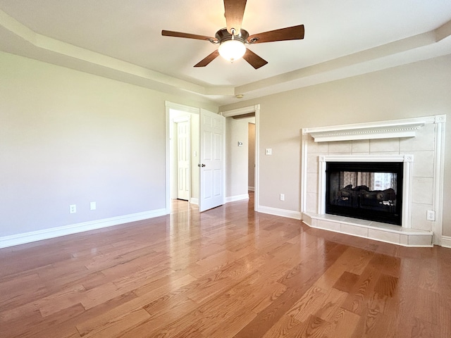 244 Water Cliff Dr, Somerset, KY 42503 - unfurnished living room with baseboards, a ceiling fan, a tile fireplace, and wood finished floors