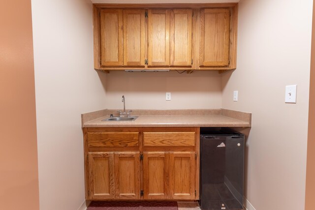 kitchen with black fridge and sink