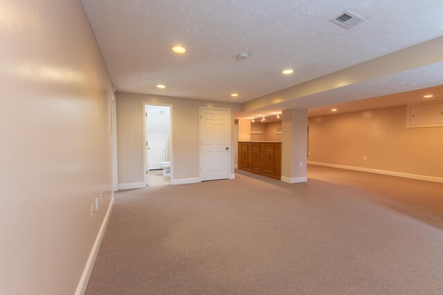 basement with a textured ceiling