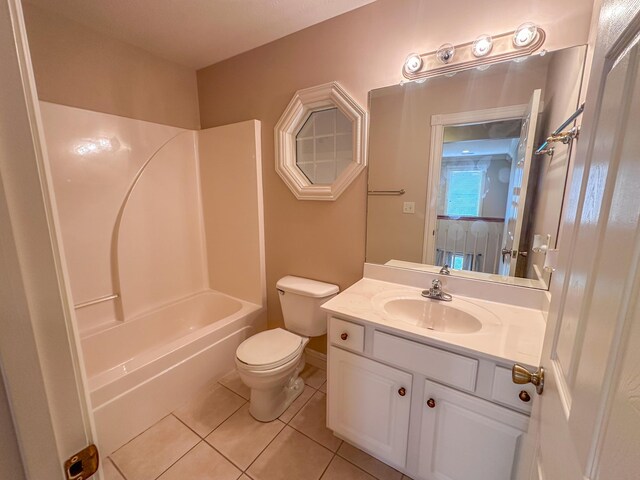 full bathroom featuring vanity, toilet, washtub / shower combination, and tile patterned floors