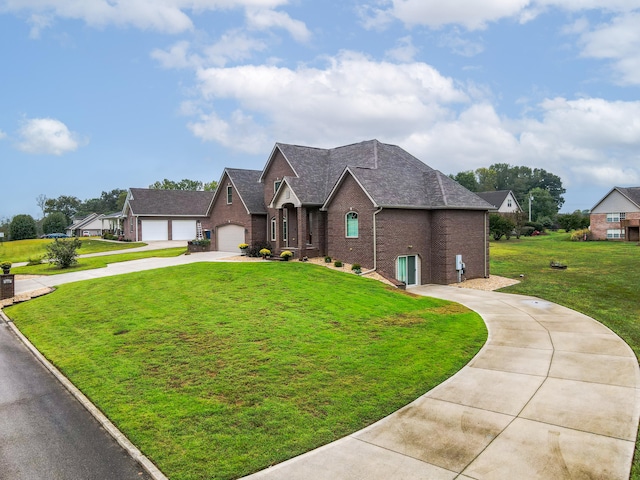 view of front of home with a garage and a front yard