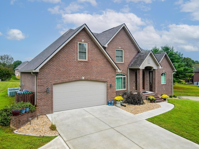 244 Water Cliff Dr, Somerset, KY 42503 - rear view of house featuring a yard, a patio, roof with shingles, brick siding, and central AC unit