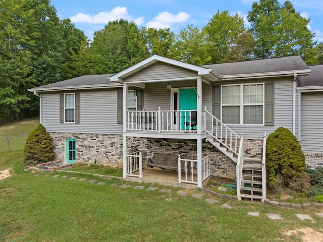 view of front of property with stairs, a porch, and brick siding