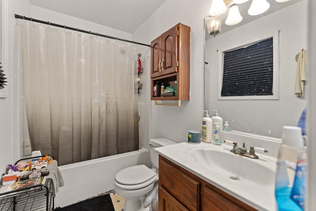 bathroom featuring toilet, vanity, and shower / tub combo