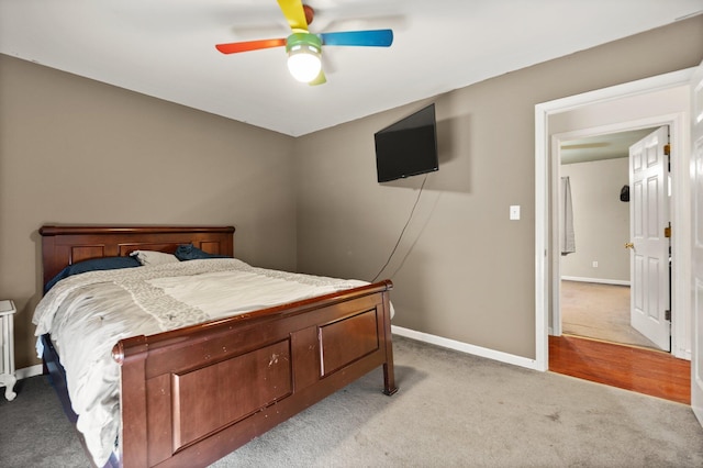 bedroom with carpet, baseboards, and a ceiling fan