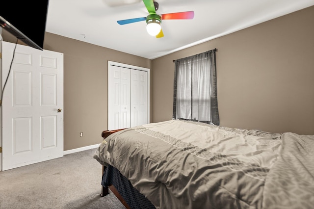 bedroom with carpet flooring, a closet, a ceiling fan, and baseboards
