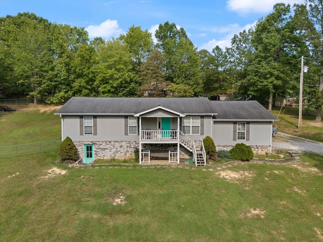 manufactured / mobile home featuring a porch and stone siding