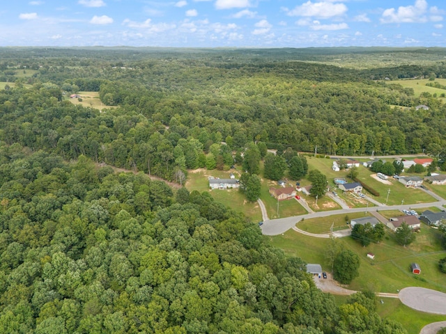 aerial overview of property's location featuring a forest