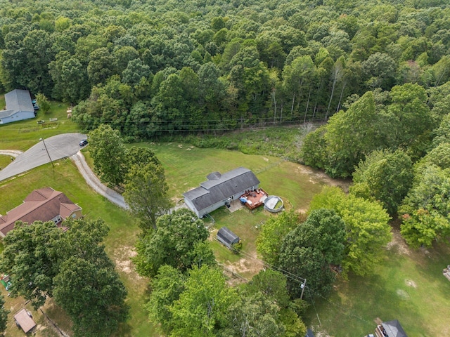 aerial overview of property's location with a forest
